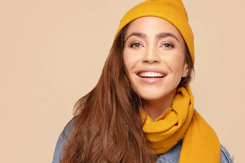 Happy woman with clear skin, enjoying stress-free holidays