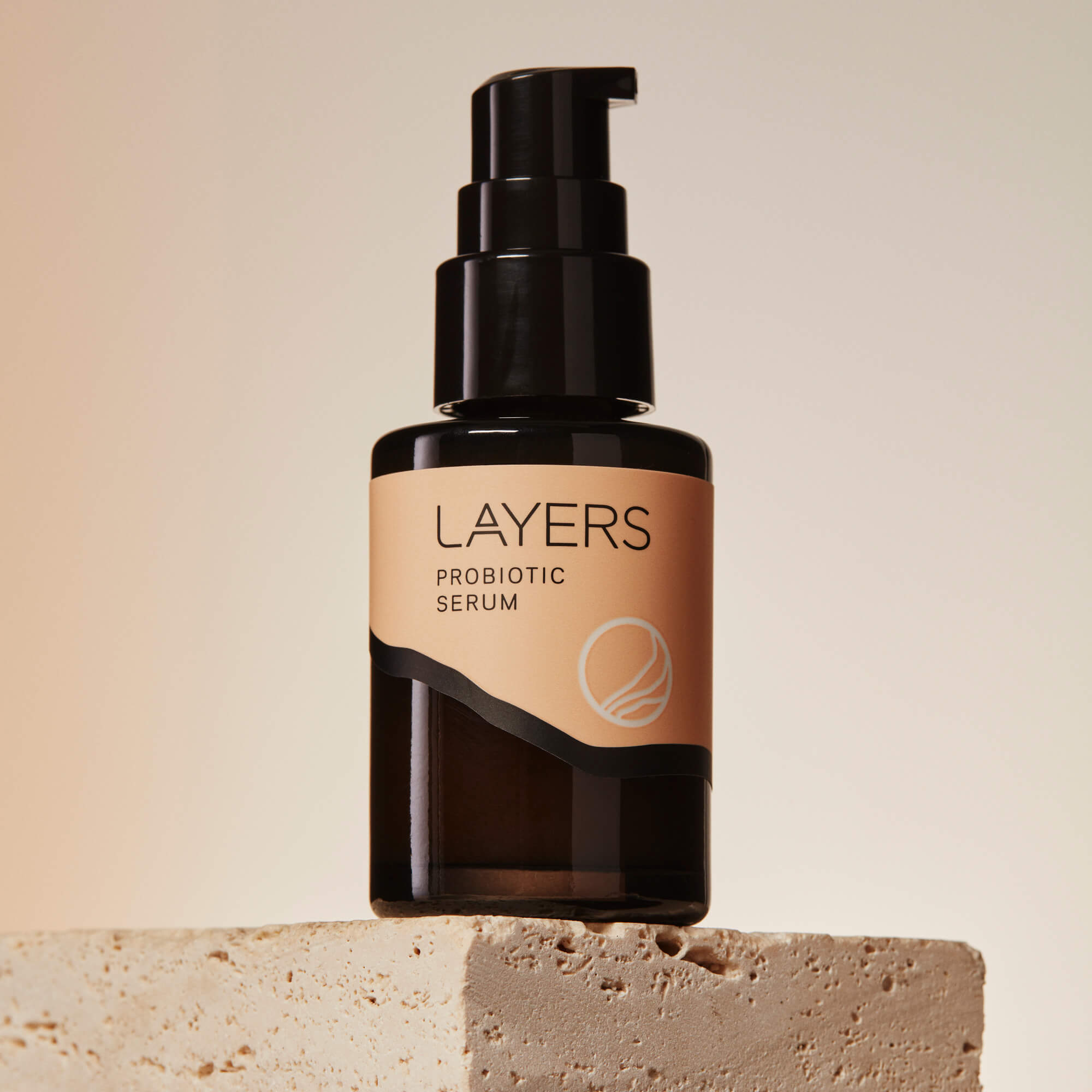 Layers Probiotic Skincare Probiotic Serum. Semi-transparent black glass bottle with pump. For dry, oily, and combination skin. 